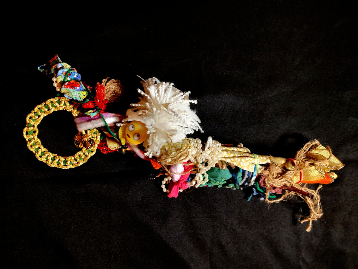 White Lady Don't Care White Lady Don't Care - an abstract wrapped stick doll with an emoji head rolling its eyes