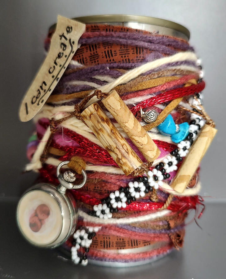 I can can - a soup can wrapped with colorful yarn and intricate decorations